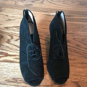 Black peep toe lace up ankle booties.